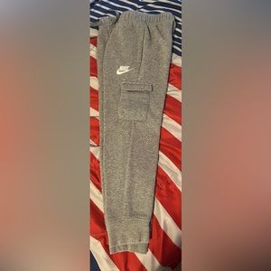 3 different Nike sweatpants . $10 a piece . Size 7